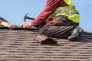 Man performing roof repair or replacement